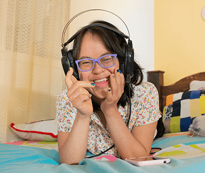 Image of a young lady wearing headphones