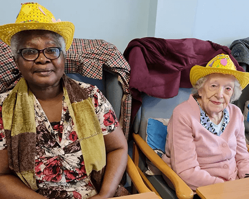 Image of two elderly women sitting down