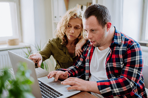 Image of a man and woman using a laptop