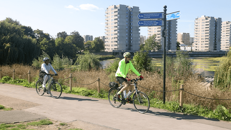 Image of two people riding their bicycles in Thamesmead