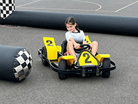 A child driving a go kart