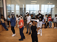 A group of people wearing virtual reality goggles
