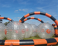 A large inflatable balls in a field
