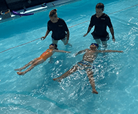 A group of people in a pool