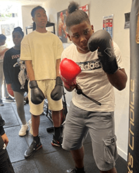 A person wearing boxing gloves