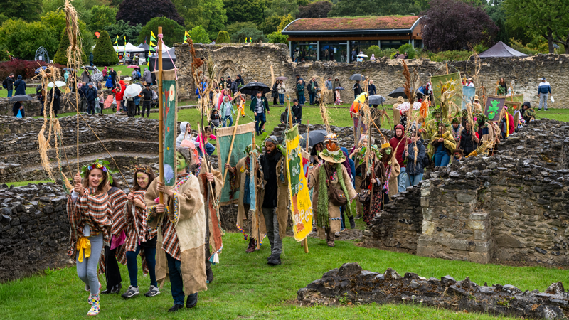 A decorative images of a procession at Lesnes Abbey in Abbey Wood