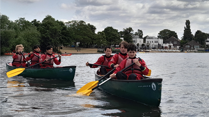 Young people conoeing on Danson Park lake