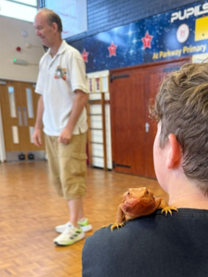 Kids treated to learning about animals, and also handling animal they would not usually see