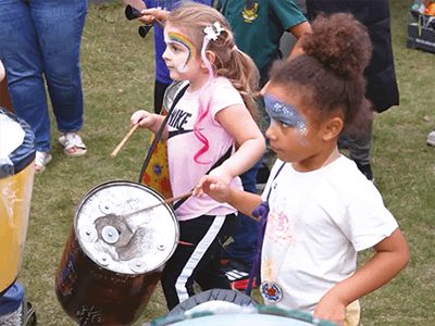 Image of children playing musical instruments