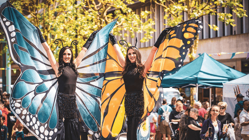 Image of Bexleyheath business event with performers dressed as butterflies