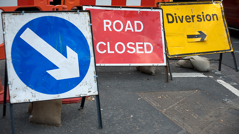 Road closed and diversion signs on the road