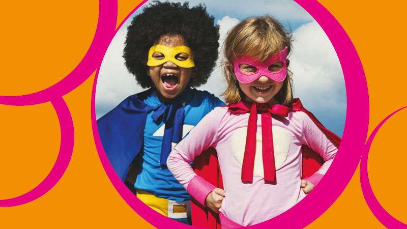 Image of two children in superman costumes