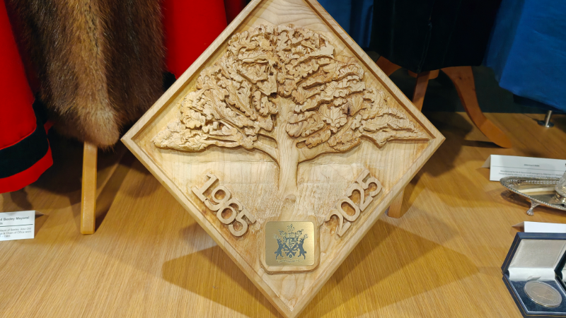 Image of the intricately carved wooden plaque including the 'Charter Oak'