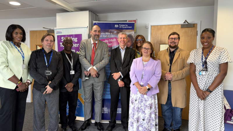 Members standing at the hub opening 