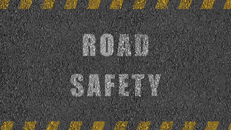 Tarmac road with words Road Safety painted on it