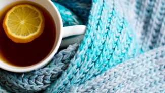 Photograph of a hot drink and a winter scarf