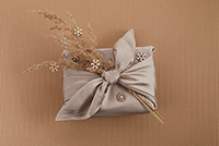A gift box with a bow and flowers