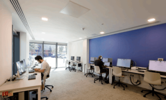 People using a workspace in a library