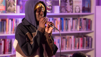 A person singing in the library 
