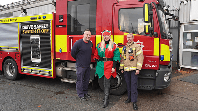 Member of the fostering team with colleagues from the London Fire Brigade 