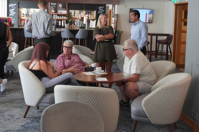 People sitting down at coffee morning