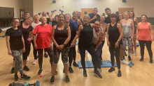 Large group of people enjoying a indoor fitness class at a leisure centre