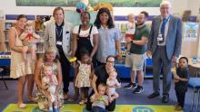 Cllr Taylor and Cllr Bishop pose with families at Crayford Library