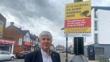 Cabinet Member for Neighbourhoods Cllr Richard Diment at one of the new fly-tipping signs 
